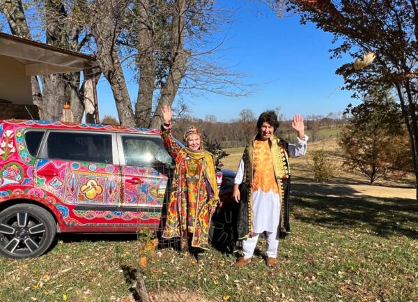 Tabla for Two standing by painted car